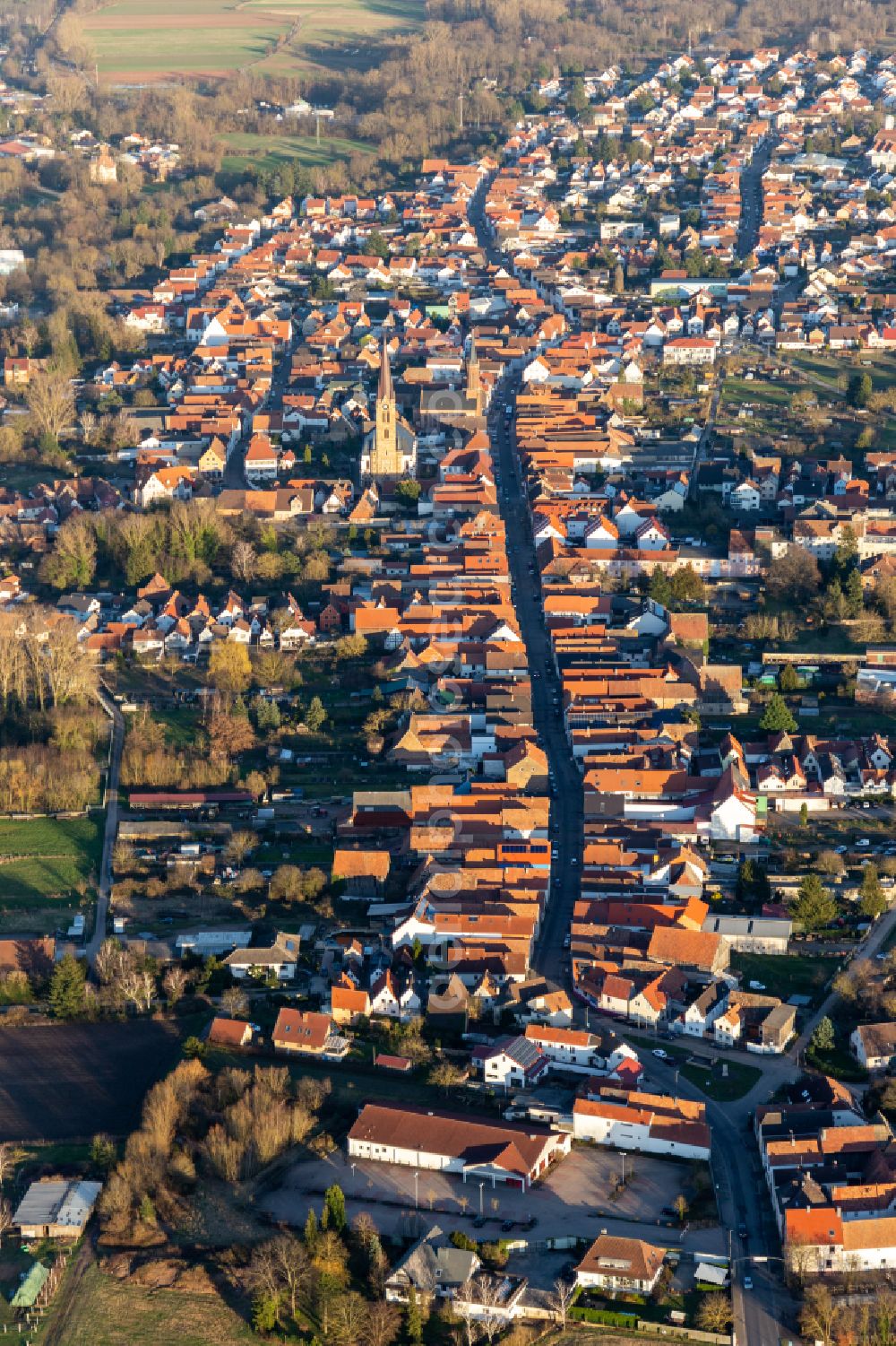 Aerial image Bellheim - Town View of the streets and houses of the residential areas on street Hauptstrasse in Bellheim in the state Rhineland-Palatinate, Germany