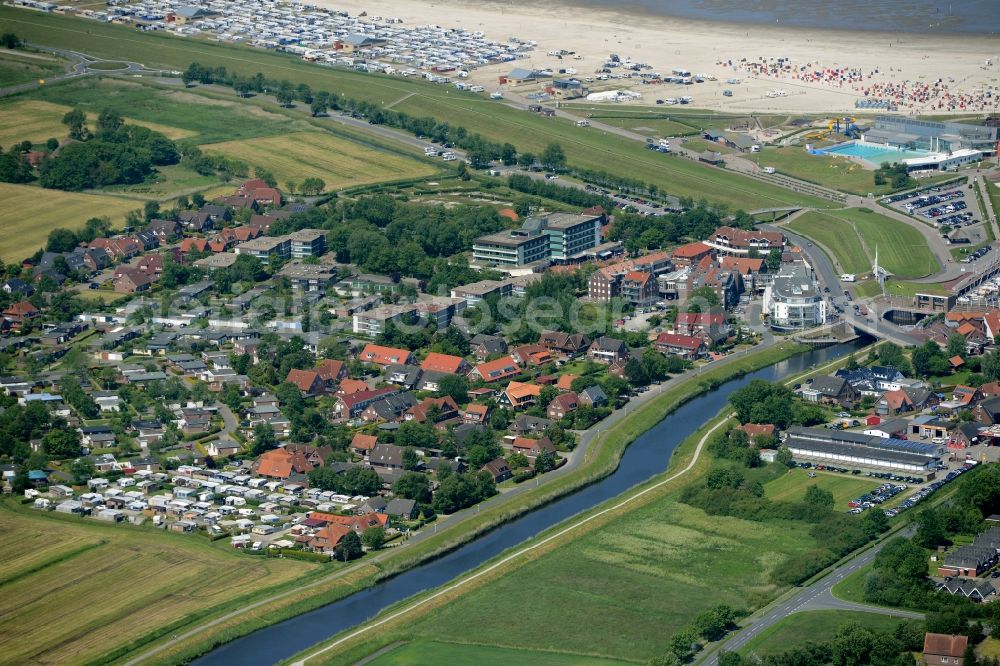 Esens from above - Town View of the streets and houses of the residential areas beneath the road Hauptstrasse at the coastline of the North Sea in Bensersiel in the state Lower Saxony