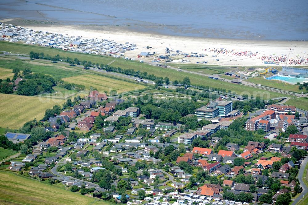 Aerial image Esens - Town View of the streets and houses of the residential areas beneath the road Hauptstrasse at the coastline of the North Sea in Bensersiel in the state Lower Saxony