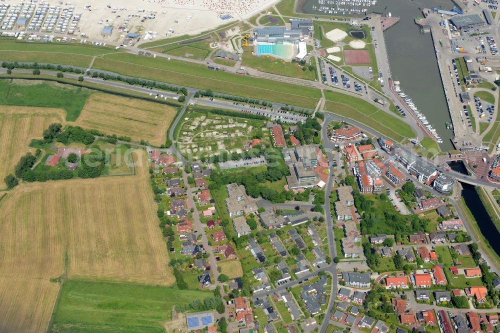 Aerial image Esens - Town View of the streets and houses of the residential areas in Bensersiel besides the roads Hauptstrasse und Taddingshoern beneath the coastline of the north sea in the state Lower Saxony