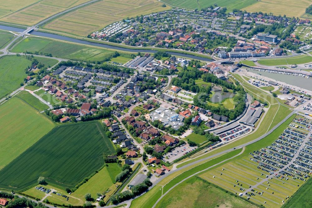 Esens from above - Town View of the streets and houses of the residential areas beneath the road Hauptstrasse at the coastline of the North Sea in Bensersiel in the state Lower Saxony