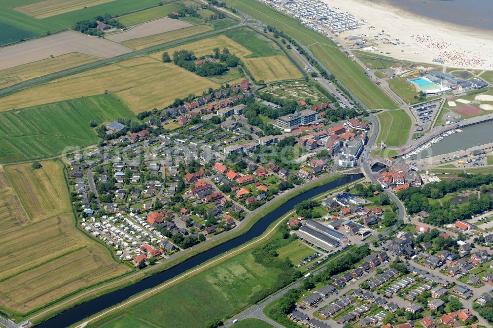 Aerial image Esens - Town View of the streets and houses of the residential areas beneath the road Hauptstrasse at the coastline of the North Sea in Bensersiel in the state Lower Saxony