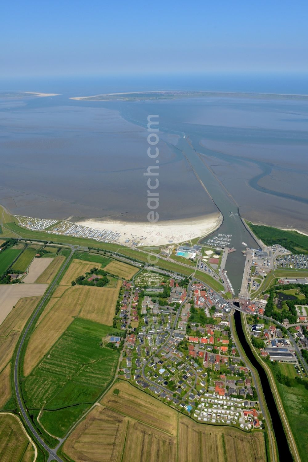 Esens from above - Town View of the streets and houses of the residential areas beneath the road Hauptstrasse at the coastline of the North Sea in Bensersiel in the state Lower Saxony