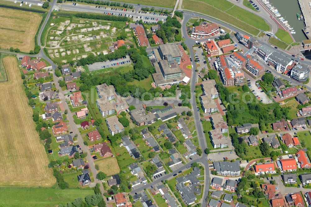 Esens from the bird's eye view: Town View of the streets and houses of the residential areas in Bensersiel besides the roads Hauptstrasse und Taddingshoern beneath the coastline of the north sea in the state Lower Saxony