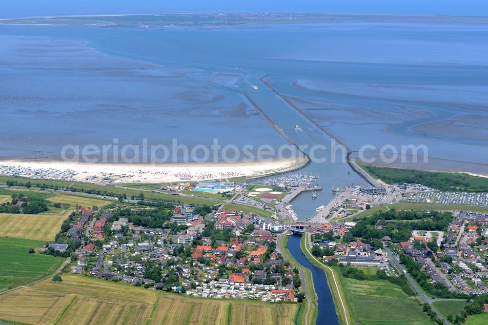 Aerial image Esens - Town View of the streets and houses of the residential areas beneath the road Hauptstrasse at the coastline of the North Sea in Bensersiel in the state Lower Saxony