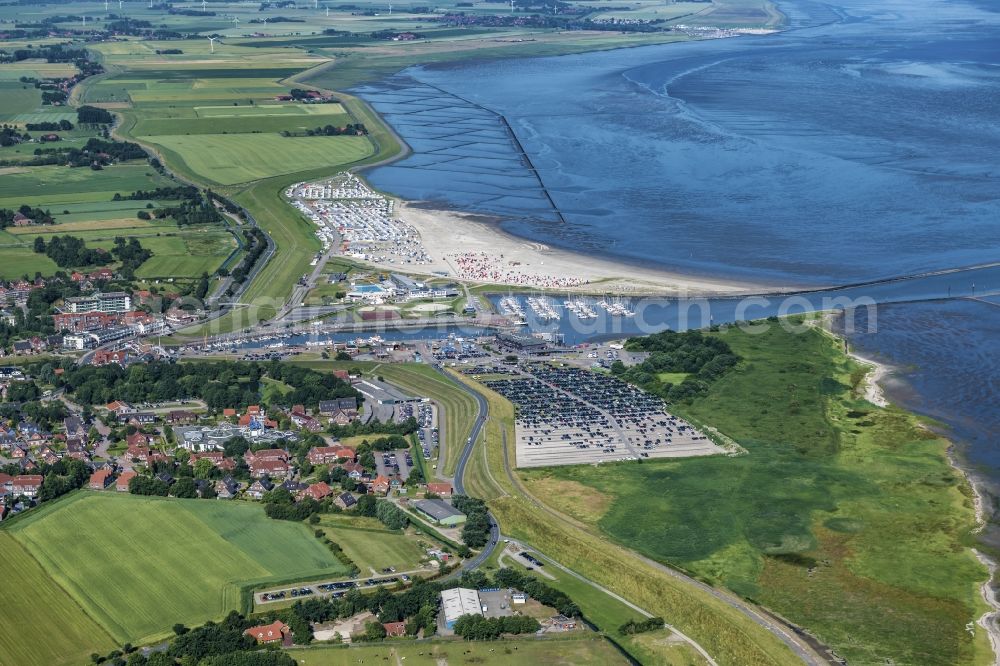 Esens from above - Town View of the streets and houses of the residential areas beneath the road Hauptstrasse at the coastline of the North Sea in Bensersiel in the state Lower Saxony