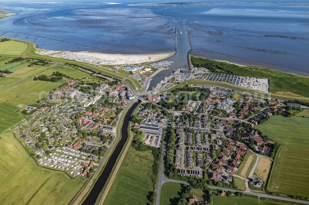 Esens from above - Town View of the streets and houses of the residential areas beneath the road Hauptstrasse at the coastline of the North Sea in Bensersiel in the state Lower Saxony