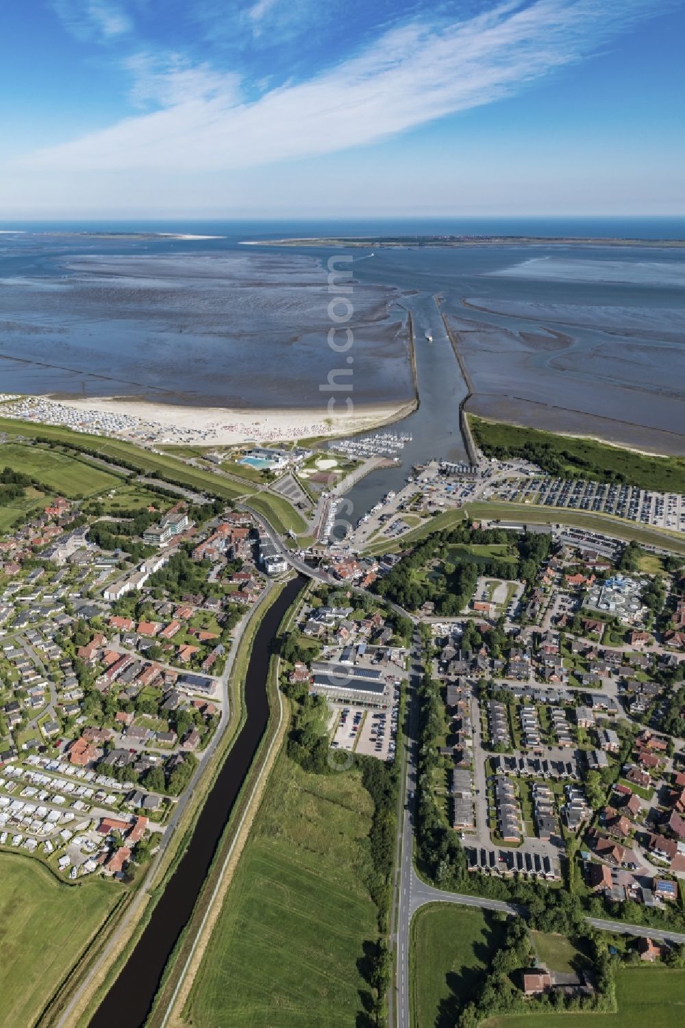 Esens from the bird's eye view: Town View of the streets and houses of the residential areas beneath the road Hauptstrasse at the coastline of the North Sea in Bensersiel in the state Lower Saxony