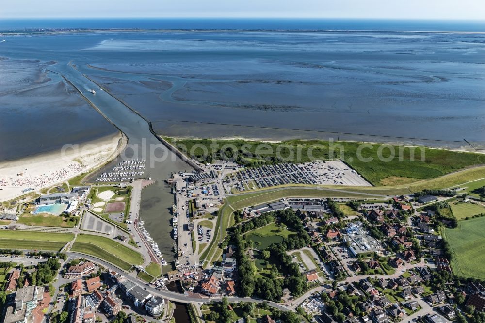 Esens from above - Town View of the streets and houses of the residential areas beneath the road Hauptstrasse at the coastline of the North Sea in Bensersiel in the state Lower Saxony