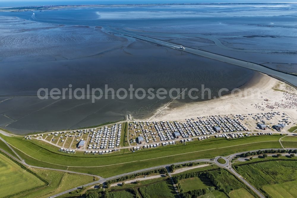 Esens from the bird's eye view: Town View of the streets and houses of the residential areas beneath the road Hauptstrasse at the coastline of the North Sea in Bensersiel in the state Lower Saxony