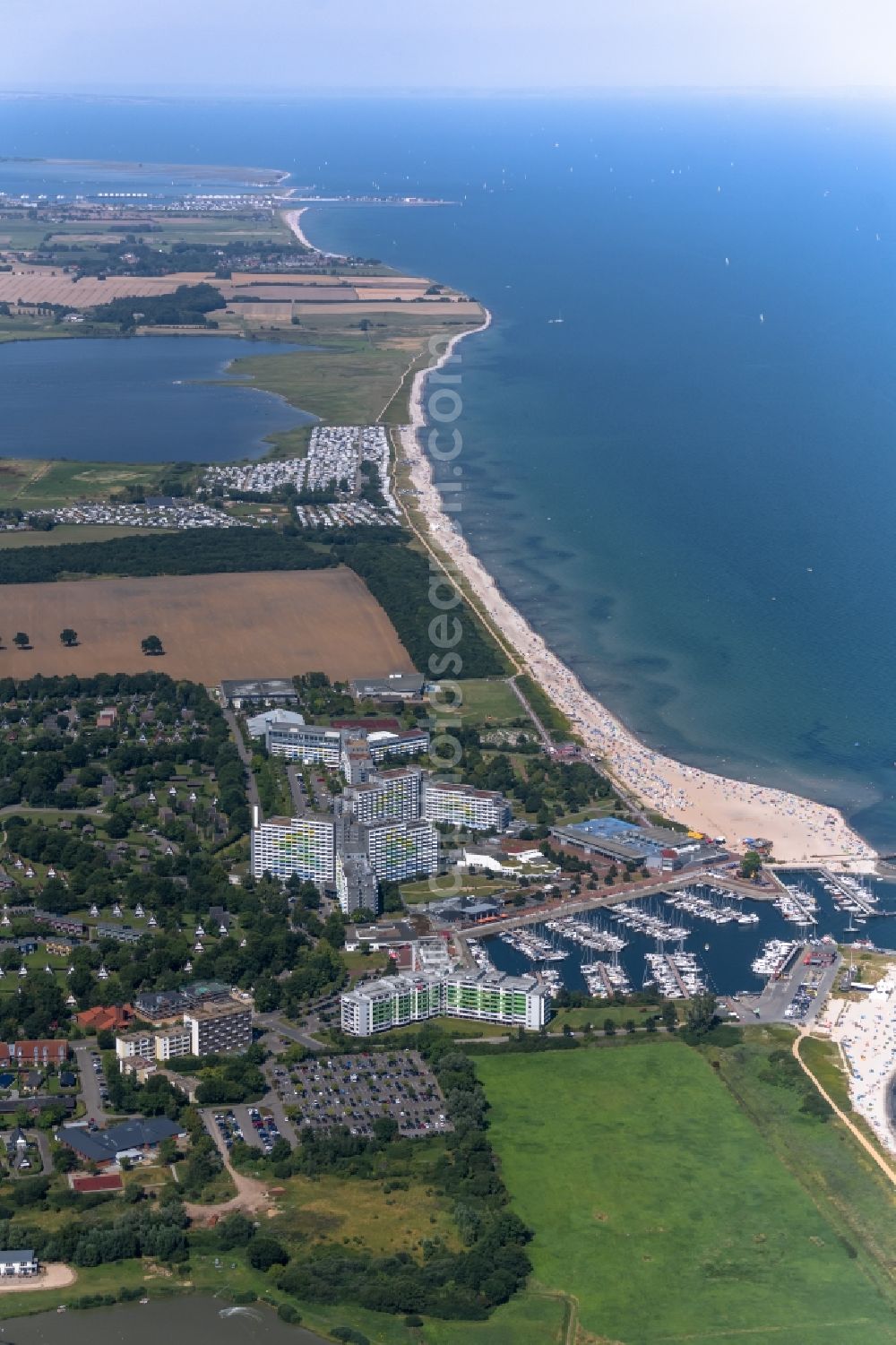 Aerial image Damp - Town view of the streets and houses of the residential areas in Damp with nearby fields at the coastline of the baltic sea in the state Schleswig-Holstein