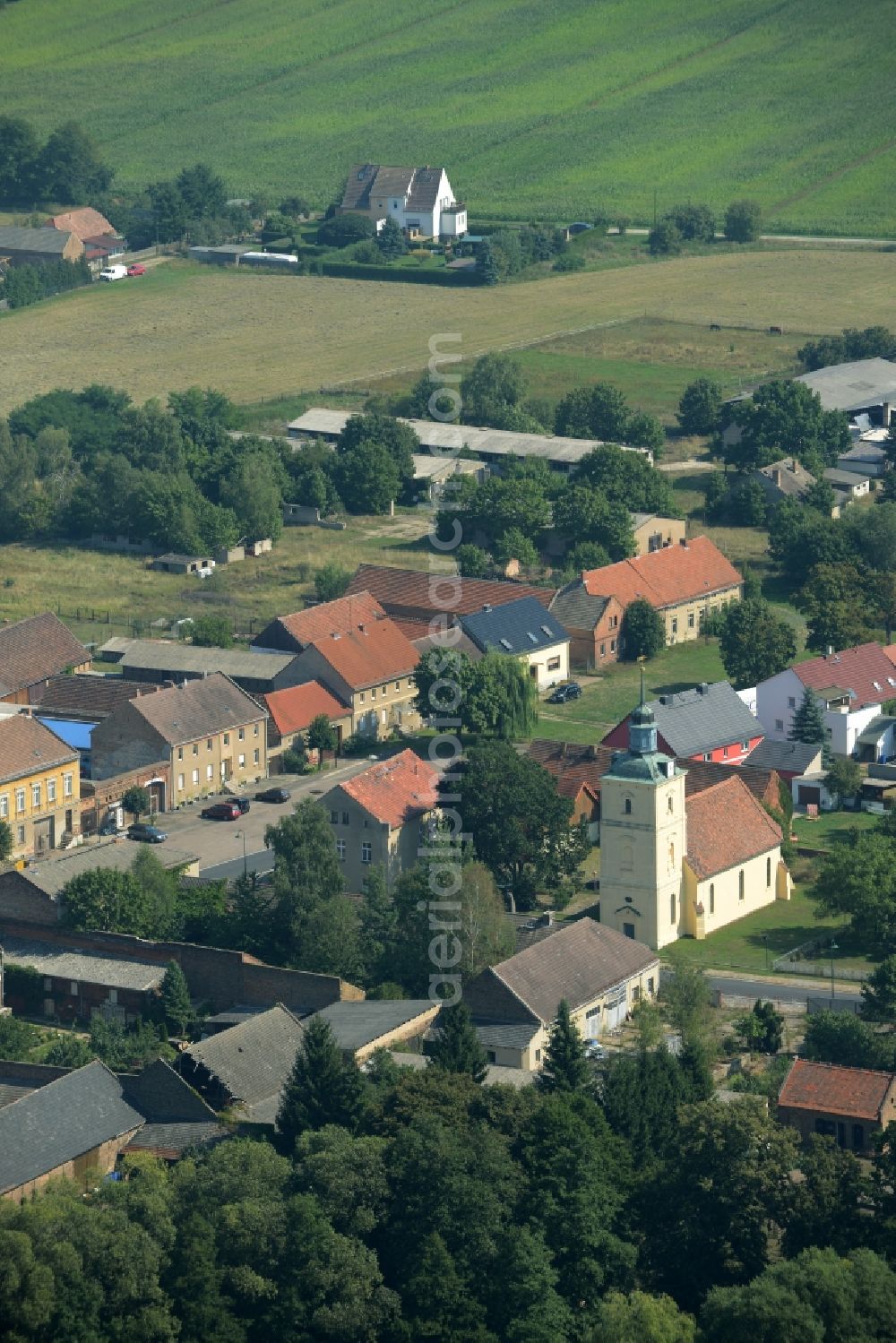 Aerial photograph Stülpe - View of the village of Stuelpe in the state of Brandenburg. The village with its church from the 16th century is located in the county district of Teltow-Flaeming. The county roads L70 and L73 are meeting here