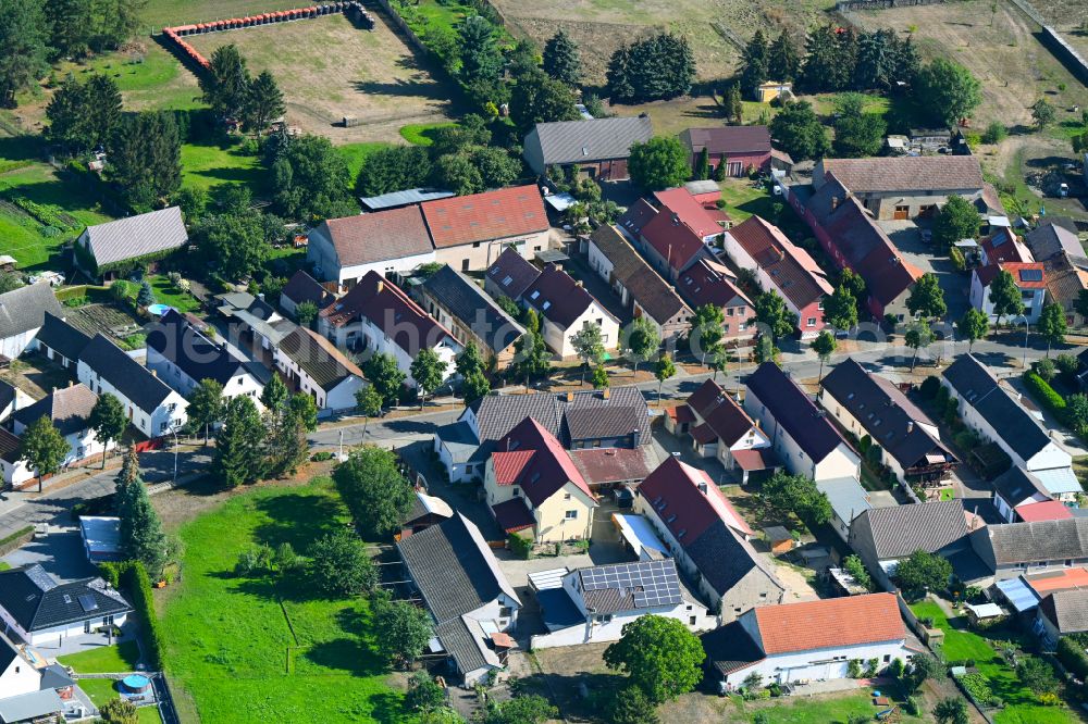 Tettau from above - City view of the streets and houses of the residential areas on Dorfstrasse in Tettau in the state Brandenburg, Germany