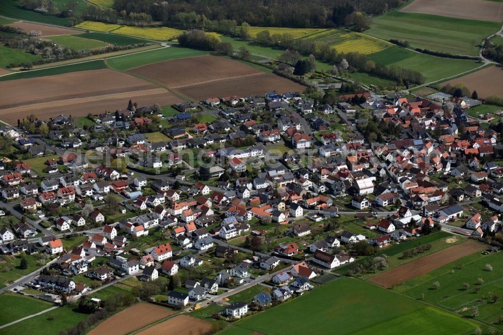 Dornholzhausen from the bird's eye view: Town View of the streets and houses of the residential areas in Dornholzhausen in the state Hesse