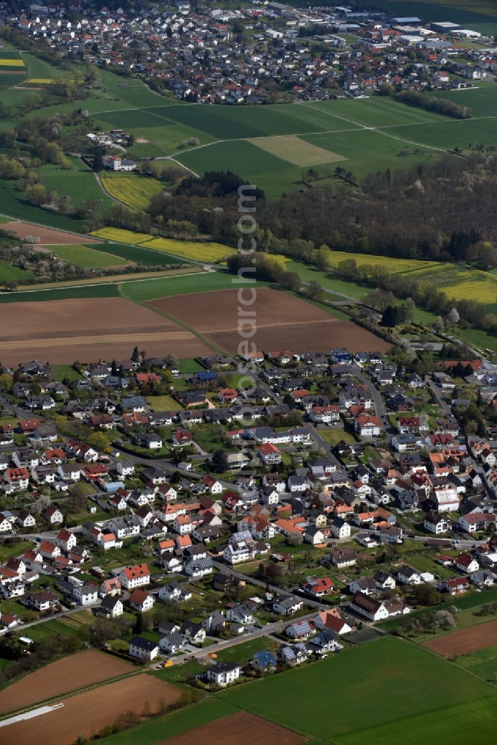 Aerial photograph Dornholzhausen - Town View of the streets and houses of the residential areas in Dornholzhausen in the state Hesse