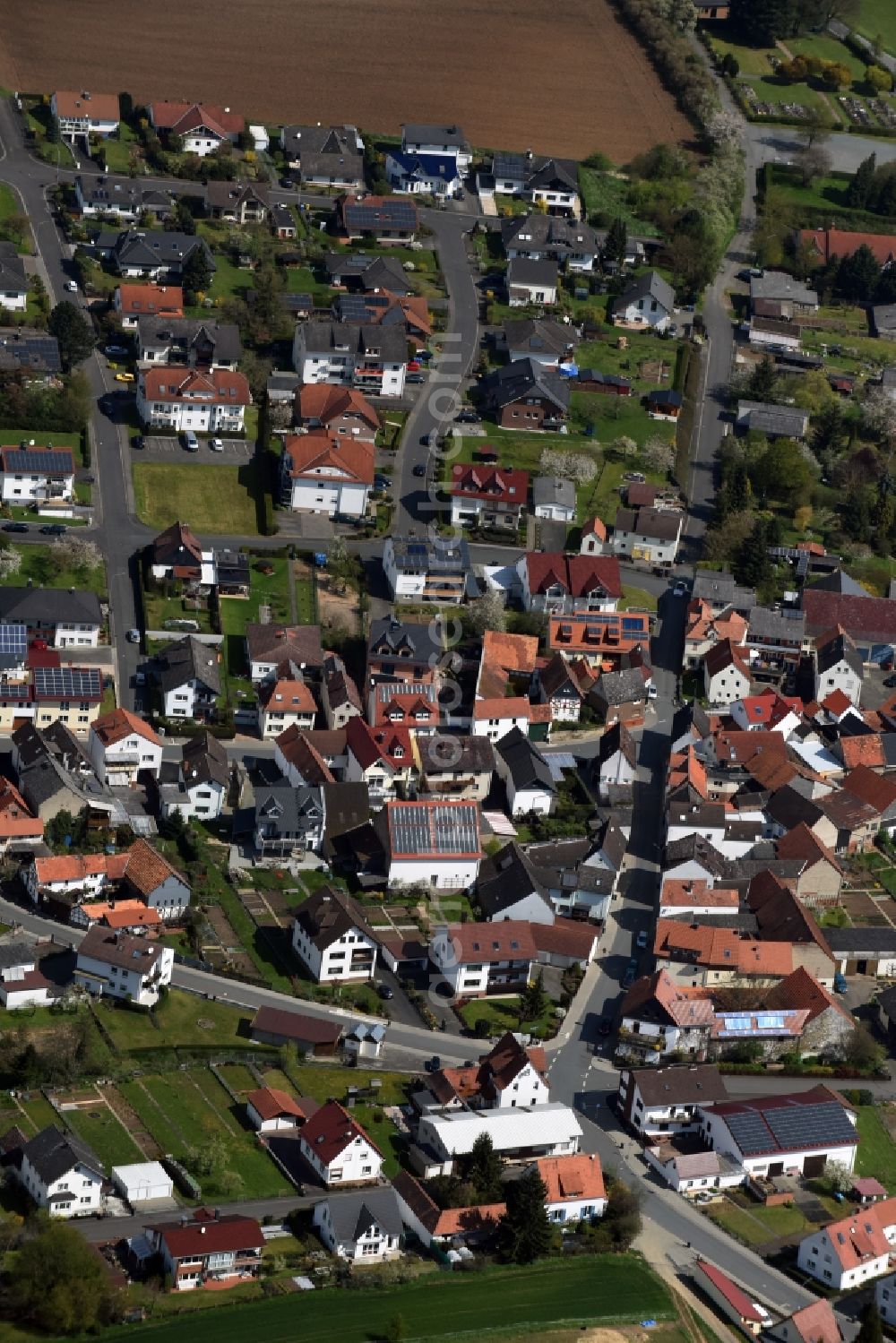 Aerial photograph Dornholzhausen - Town View of the streets and houses of the residential areas in Dornholzhausen in the state Hesse