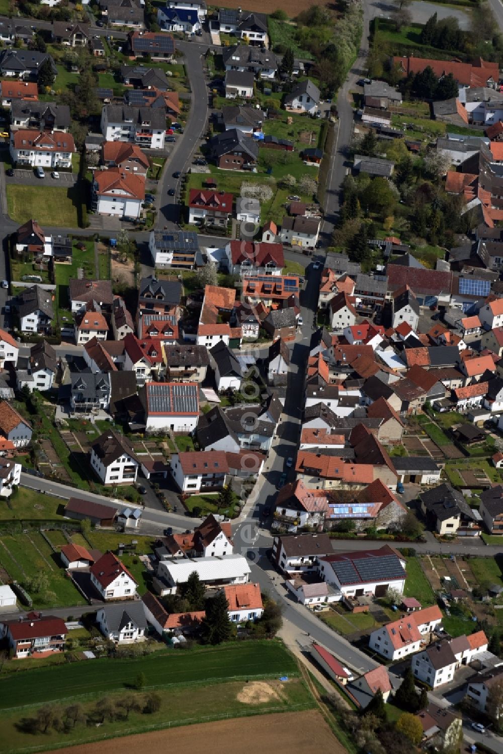 Dornholzhausen from above - Town View of the streets and houses of the residential areas in Dornholzhausen in the state Hesse