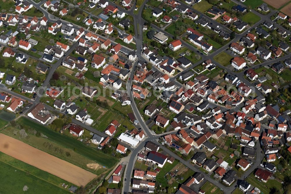 Dornholzhausen from the bird's eye view: Town View of the streets and houses of the residential areas in Dornholzhausen in the state Hesse