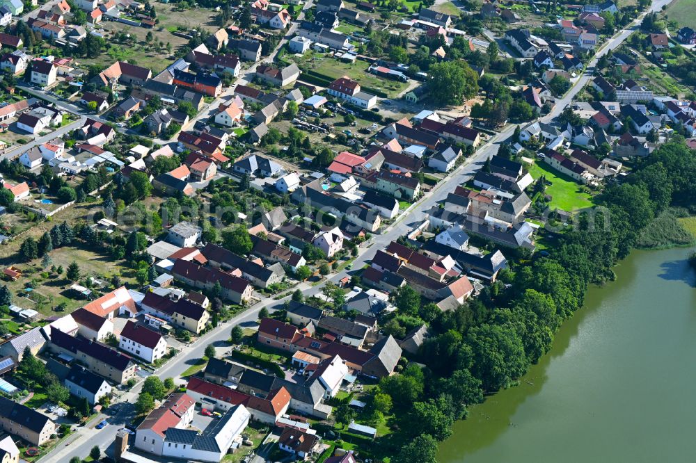 Lindenau from above - Town View of the streets and houses of the residential areas along the main street in Lindenau in the state Brandenburg, Germany