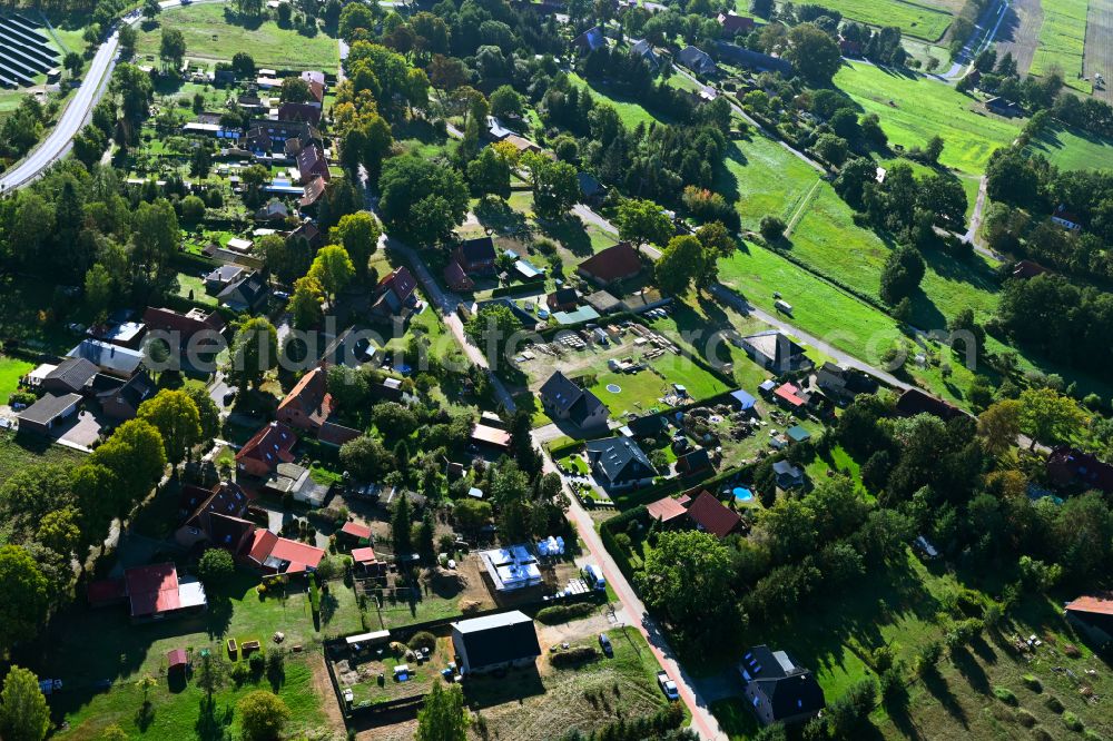 Strohkirchen from above - Town view of the streets and houses of the residential areas along the road Schmiedeweg in Strohkirchen in the state Mecklenburg - Western Pomerania, Germany