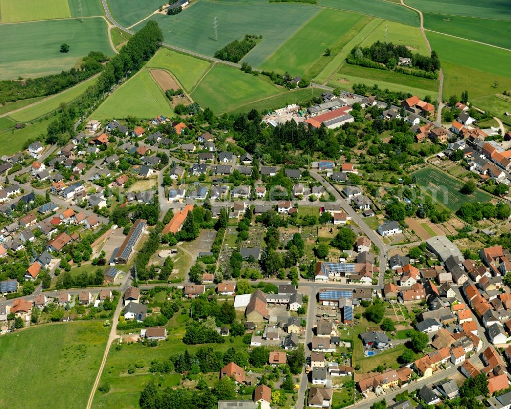 Aerial image Feilbingert - View of the borough of Feilbingert in the state of Rhineland-Palatinate. The municipiality is located on the edge of the North Palatinate Mountains amidst vineyards and forest. The agricultural village with its single family houses and farms has been on site since the 11th century