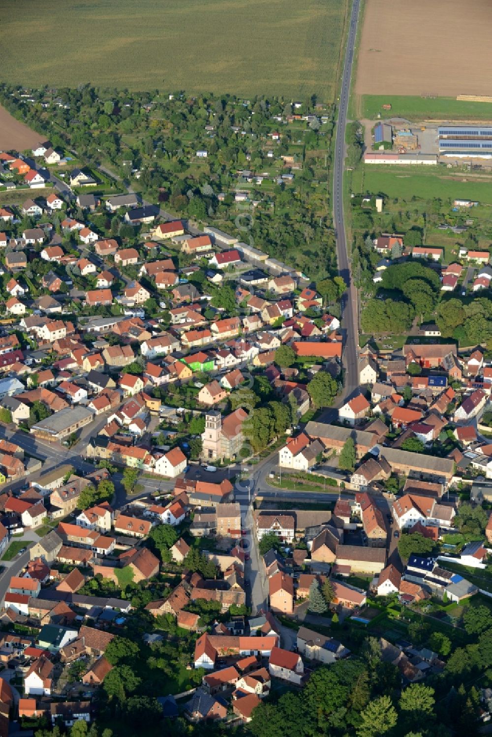 Aerial image Edersleben - View of the borough of Edersleben in the state of Saxony-Anhalt. The village is located on federal highway B86. The church St.Bartholomew is located in its center