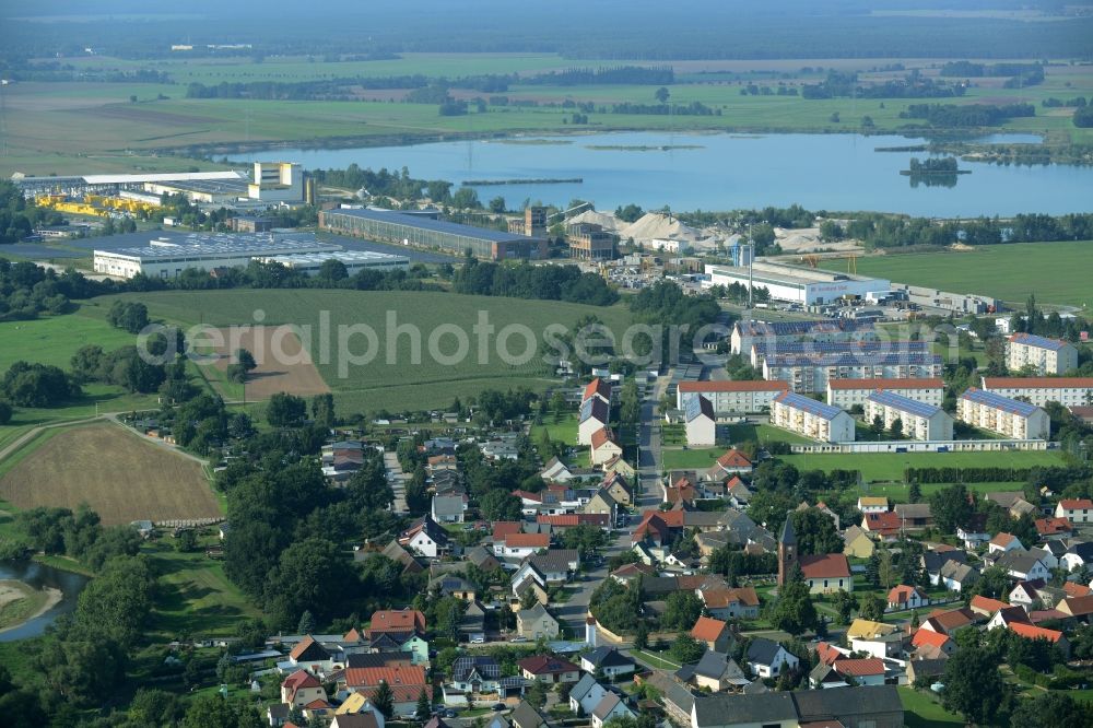 Aerial image Laußig - View of the borough of Laussig in the state of Saxony. The lake and gravel pit Lausig-North is located in the background