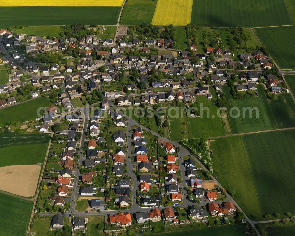 Lutzingen from above - View of the borough of Lutzingen in the state of Bavaria. Lutzingen is located in the West of the free state and consists mostly of symmetrically lined up residential and semi-detached houses and streets. Lutzingen is surrounded by fields and agricultural land