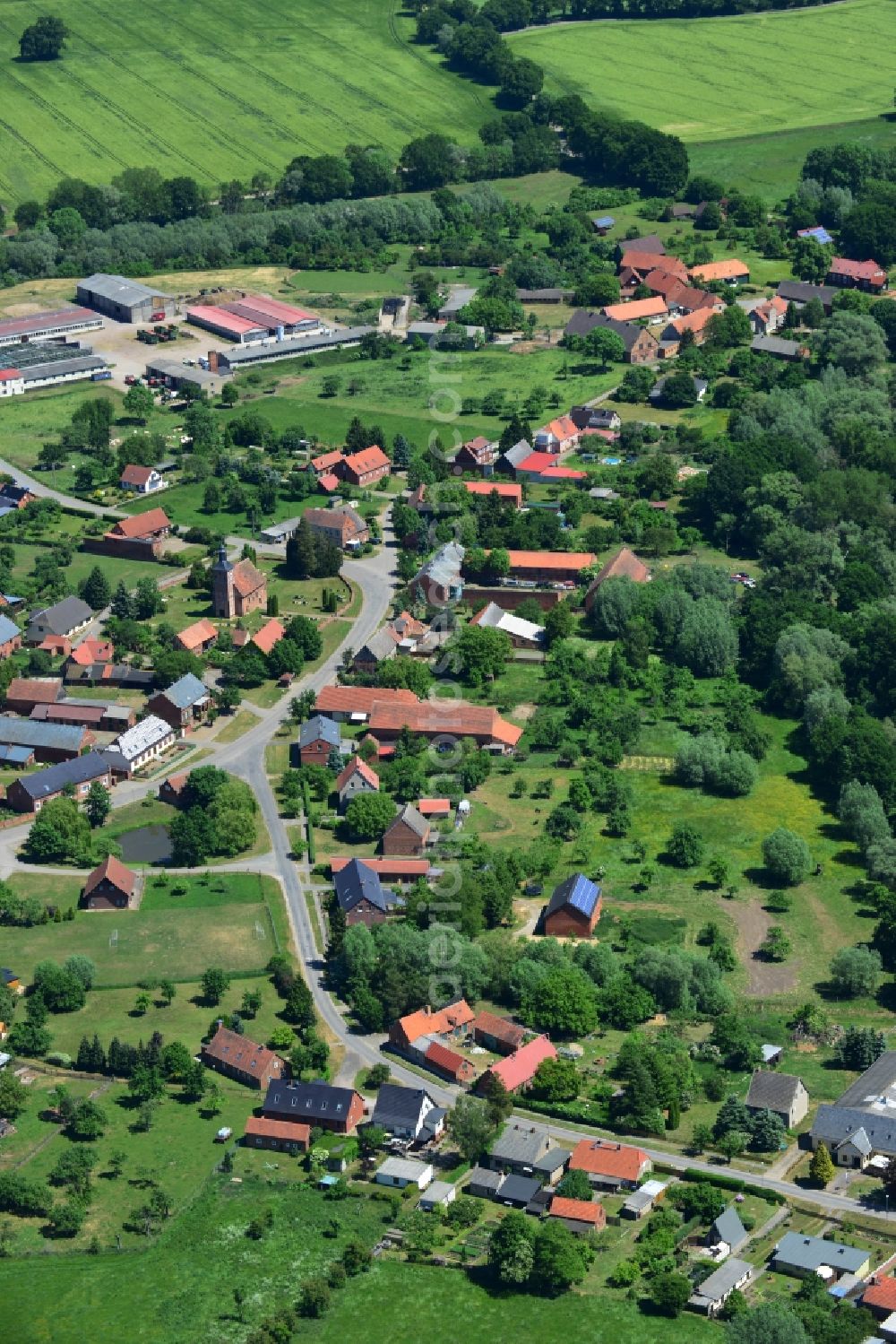 Rühstädt from above - View of the borough of Ruehstaedt in the state of Brandenburg. The village is located in the county district of Prignitz, is characterised by small houses and farms and is surrounded by fields and forest