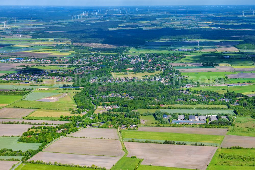 Humptrup from the bird's eye view: View of the streets and houses of the residential areas in Grellsbuell in the state Schleswig-Holstein, Germany