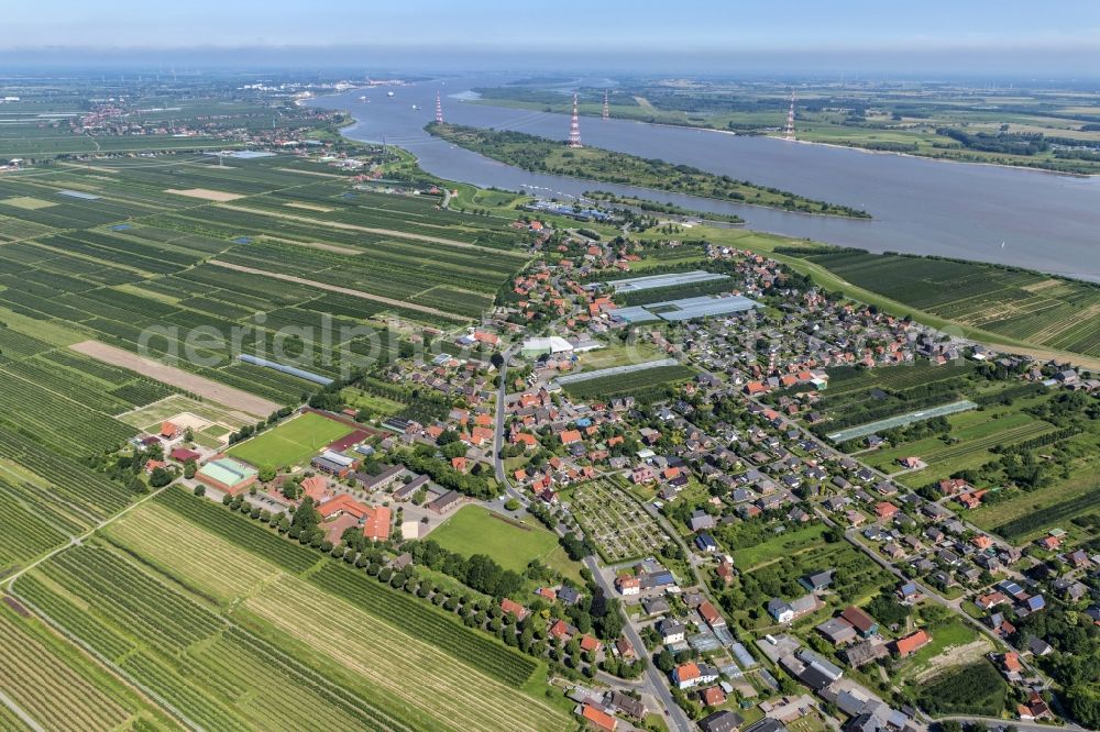 Grünendeich from above - Town view of the streets and houses of the residential areas in Gruenendeich in the Altes Land in the state Lower Saxony, Germany