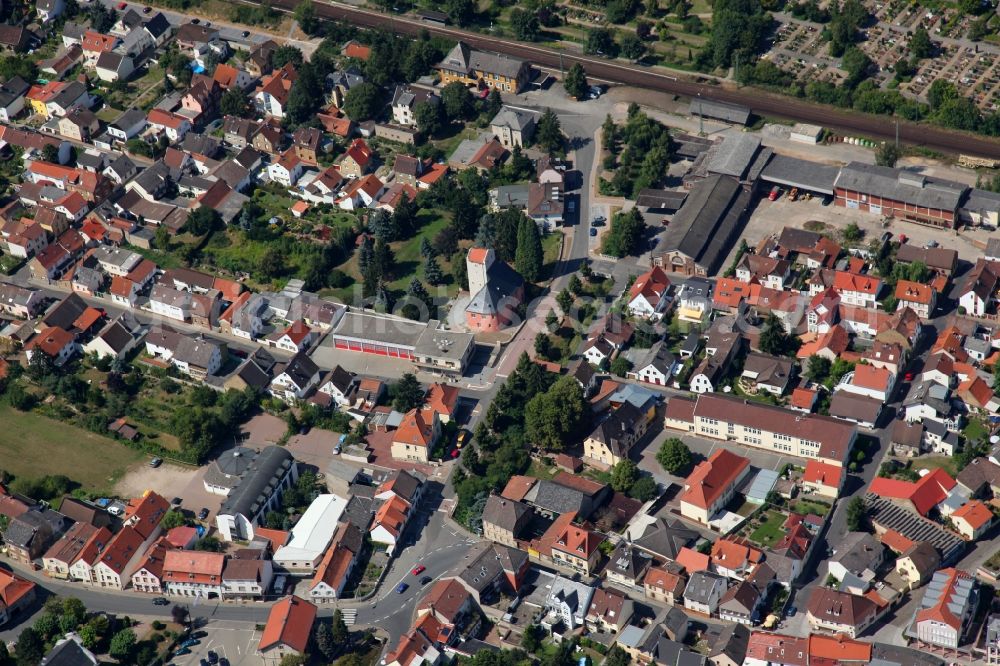 Heidesheim am Rhein from above - View of the town of Heidesheim am Rhein in the state of Rhineland-Palatinate. Heidesheim is one of the largest boroughs of the Rheinhessen region and is located on the southern Rhine riverbank - the Rhine knee - in the district of Mainz-Bingen. View of the Western part of Heidesheim with the railroad tracks and the tower castle Windeck