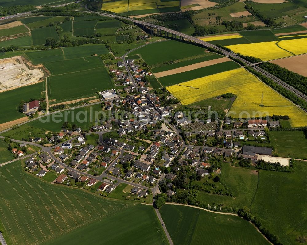 Aerial image Grafschaft - View of the village of Karweiler in the borough of Grafschaft in the state of Rhineland-Palatinate. Karweiler is surrounded by agricultural land like rapeseed fields on the federal motorway A 573. It is one of 11 localities of Grafschaft