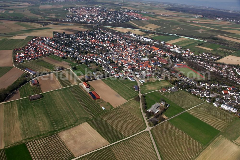 Aerial photograph Klein-Winternheim - Townscape of Klein-Winternheim and its surrounding landscape in the state of Rhineland-Palatinate. The borough is located in the Main-Bingen district neighbouring Ober-Olm and adjacent to the federal motorway A63. The borough's economy was dominated by viniculture and fruit cultivation and it is still surrounded by fields and agricultural spaces