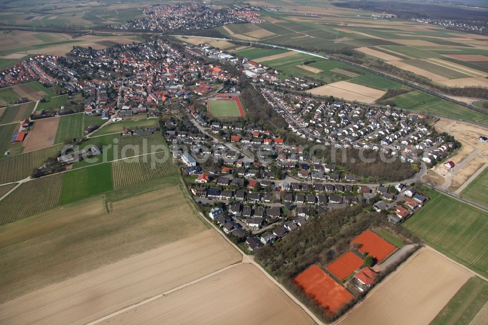 Klein-Winternheim from above - Townscape of Klein-Winternheim and its surrounding landscape in the state of Rhineland-Palatinate. The borough is located in the Main-Bingen district neighbouring Ober-Olm and adjacent to the federal motorway A63. The borough's economy was dominated by viniculture and fruit cultivation and it is still surrounded by fields and agricultural spaces