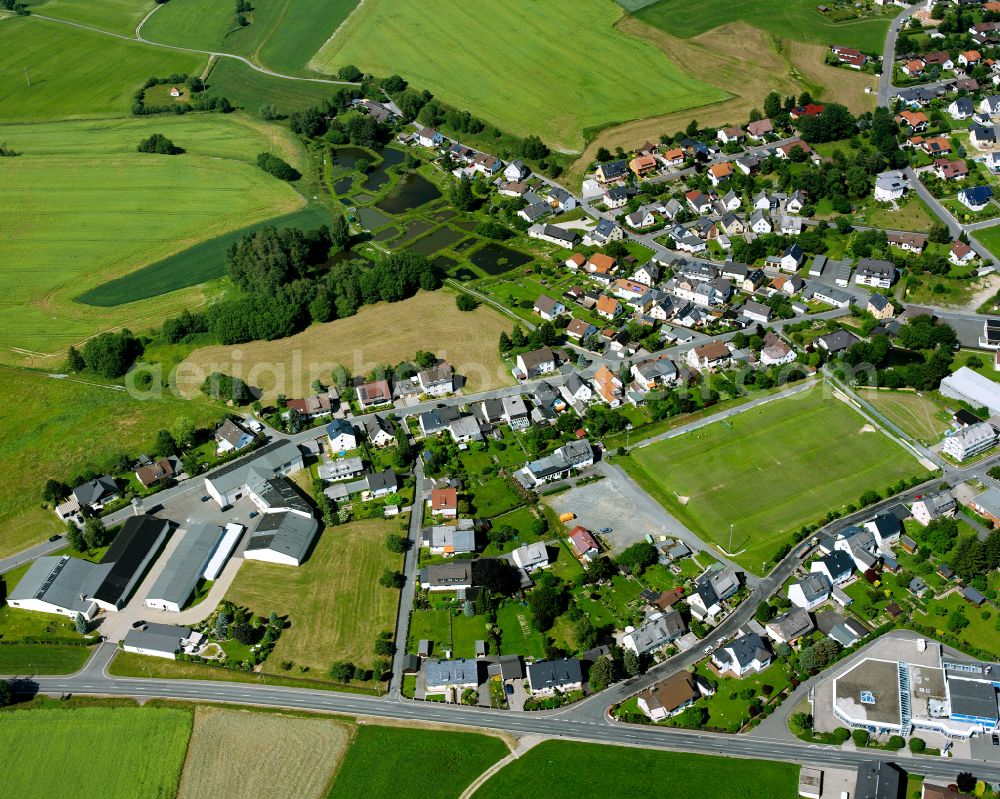 Aerial image Konradsreuth - Town View of the streets and houses of the residential areas on street Sportplatzstrasse in Konradsreuth in the state Bavaria, Germany