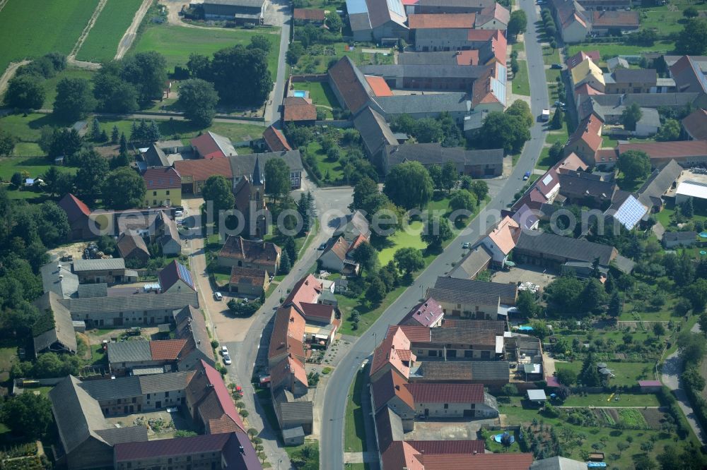 Aerial image Langenlipsdorf - View of the village of Langenlipsdorf in the state of Brandenburg. The village consists of residential houses and agricultural farms and is surrounded by fields. The village church is located on a small pond