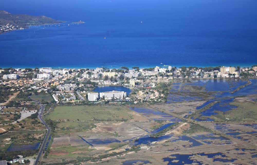 Aerial image Muro - Townscape on the seacoast of Playa de Muro in the nature reserve S'Albufera in Mallorca in Balearic Islands, Spain