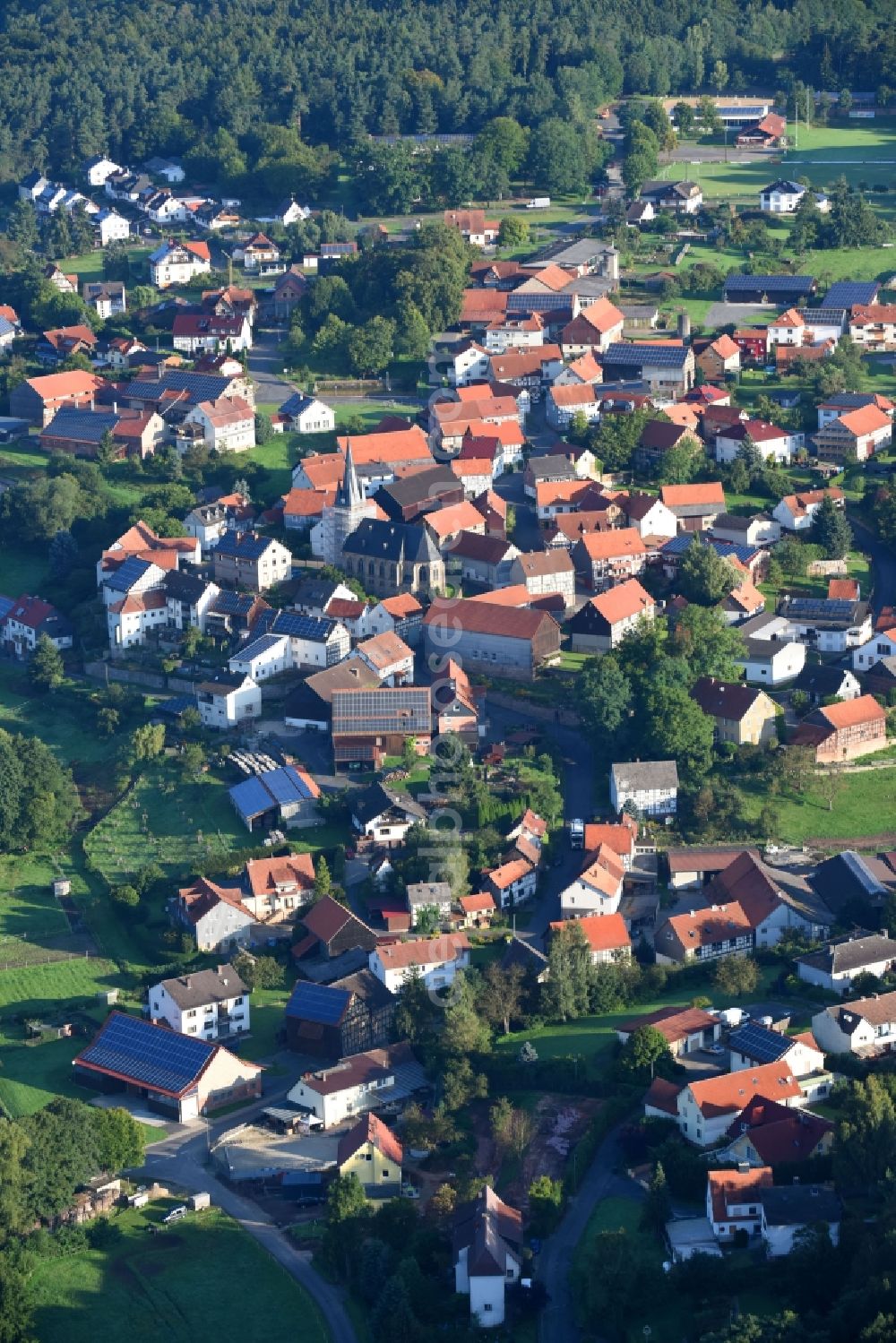 Mengsberg from above - Town View of the streets and houses of the residential areas in Mengsberg in the state Hesse, Germany