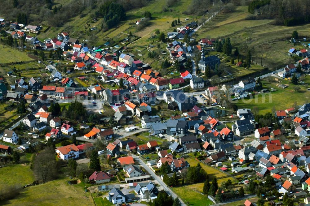 Aerial image Möhrenbach - City view of the streets and houses of the residential areas in the landscape surrounded by mountains and forest in Moehrenbach in the state Thuringia, Germany