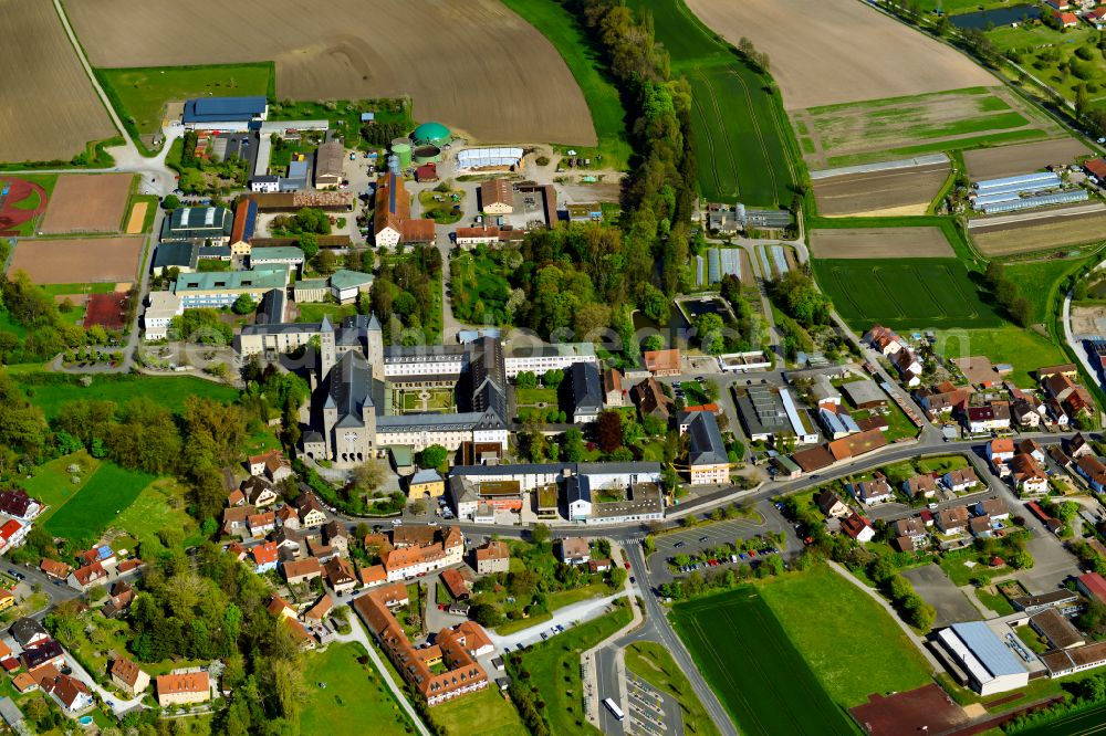 Aerial photograph Münsterschwarzach - Town View of the streets and houses of the residential areas in Münsterschwarzach in the state Bavaria, Germany