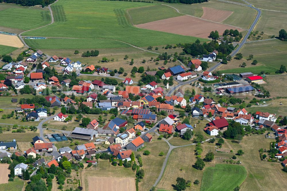 Mudau from above - Town View of the streets and houses of the residential areas in Mudau in the state Baden-Wuerttemberg, Germany