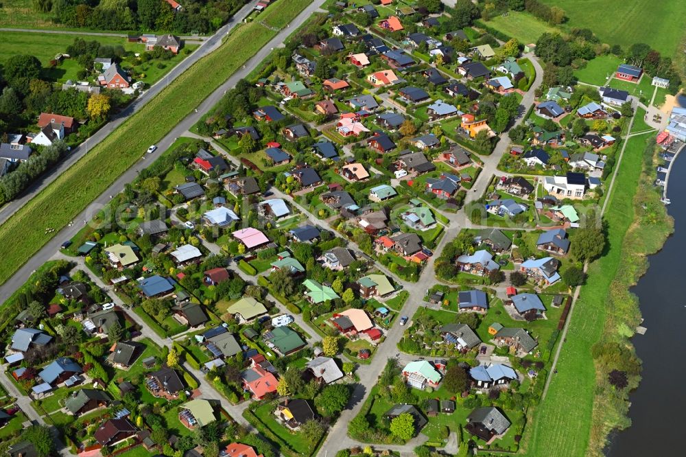 Neuhäuserdeich from above - Town View of the streets and houses of the residential areas in Neuhaeuserdeich in the state Lower Saxony, Germany