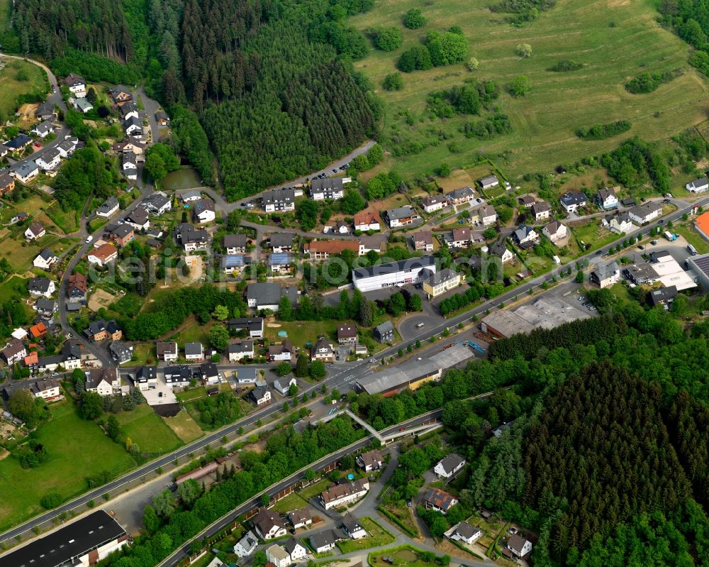 Aerial photograph Niederfischbach - View of the borough of Niederfischbach in the state of Rhineland-Palatinate. The borough is located in the West of the Giebel Forest and is characterised by agriculture and wooded hills. The creeks Asdorf and Fischbach take their courses through the borough