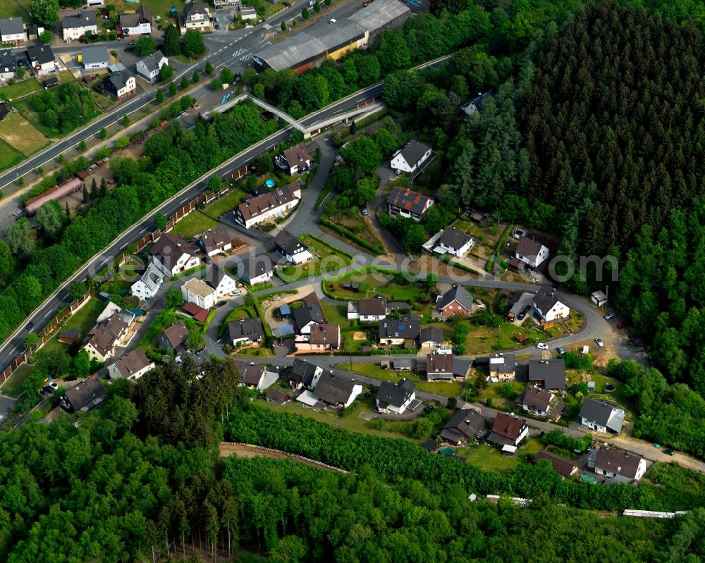 Niederfischbach from above - View of the borough of Niederfischbach in the state of Rhineland-Palatinate. The borough is located in the West of the Giebel Forest and is characterised by agriculture and wooded hills. The creeks Asdorf and Fischbach take their courses through the borough