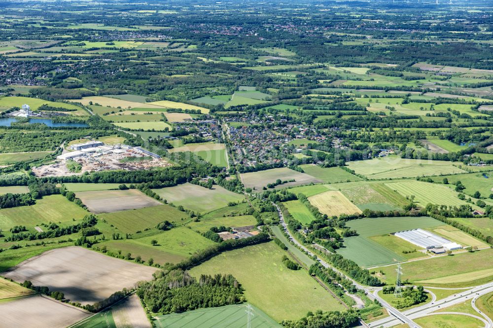 Nützen from the bird's eye view: Town View of the streets and houses of the residential areas in Nuetzen in the state Schleswig-Holstein, Germany