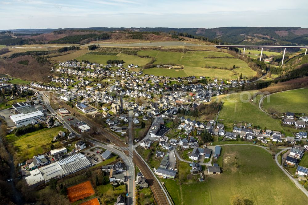 Aerial image Nuttlar - Town View of the streets and houses of the residential areas in Nuttlar at Sauerland in the state North Rhine-Westphalia, Germany