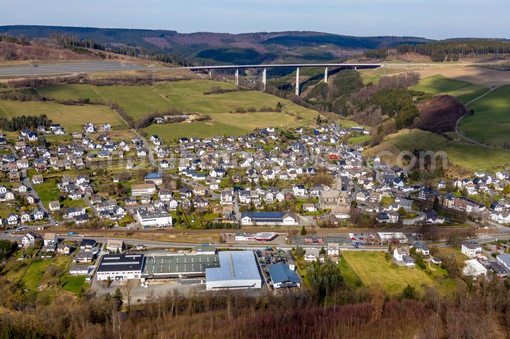 Nuttlar from above - City view of the streets and houses of the residential areas with Talbruecke Nuttlar in Nuttlar in the Sauerland in the state North Rhine-Westphalia, Germany