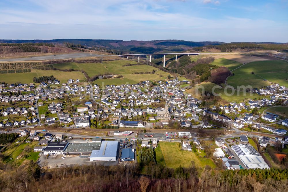 Aerial image Nuttlar - City view of the streets and houses of the residential areas with Talbruecke Nuttlar in Nuttlar in the Sauerland in the state North Rhine-Westphalia, Germany