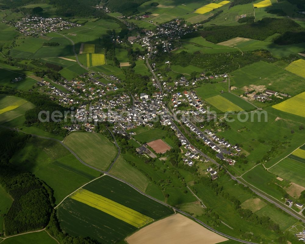 Aerial image Oberzissen - View of the borough of Oberzissen in the state of Rhineland-Palatinate. The borough is located in the protected landscape region of Rhine-Ahr-Eifel. The agricultural borough is surrounded by fields and meadows